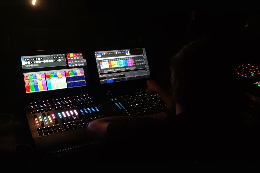 Video editor working at a multi-monitor post-production desk