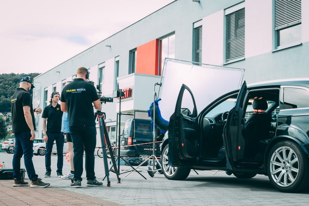Outside broadcast van with technicians connecting cables